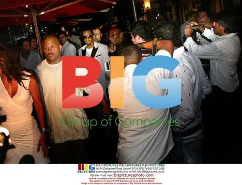 Diddy surrounded by paparazzi