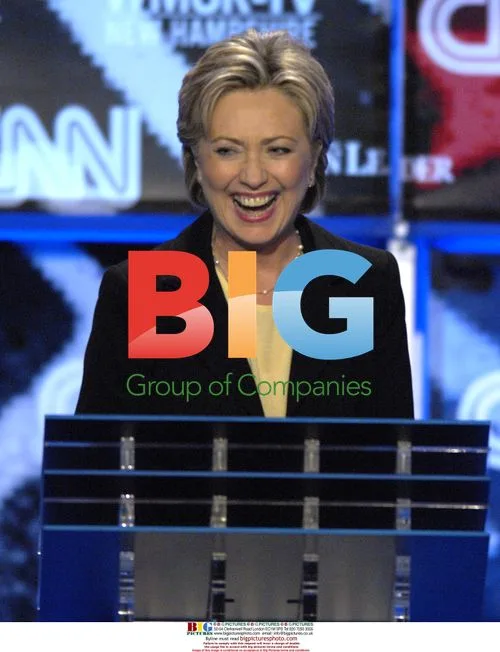 Hillary Clinton laughs on debate stage