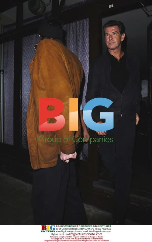 Pierce Brosnan and son leaving McCartney gig