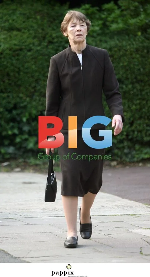 Glenda Jackson striding as a politician