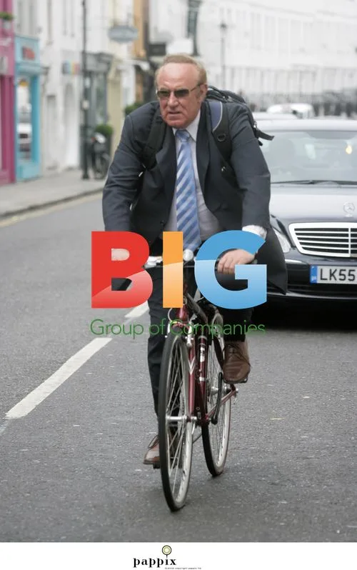 Andrew Neill Rides Bike Without Helmet in London