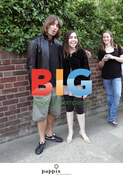 Liam Gallagher poses with teens in London