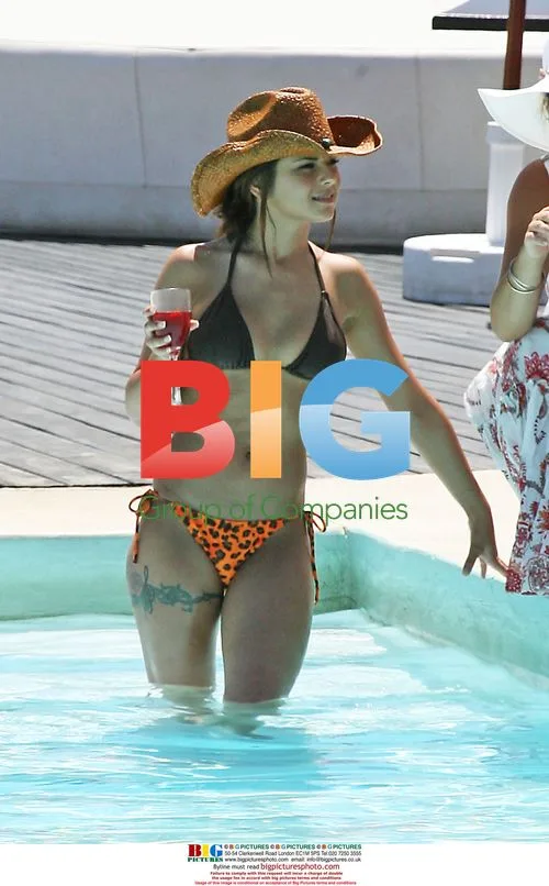 Footballer Ashley Cole and wife Cheryl relax on holiday