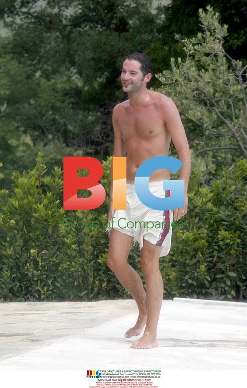 Tamzin Outhwaite and Tom Ellis by pool in Tuscany