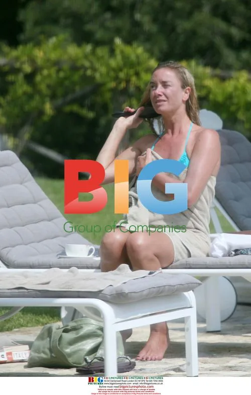 Tamzin Outhwaite and Tom Ellis at pool in Tuscany