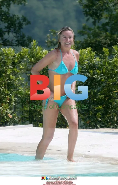 Tamzin Outhwaite and Tom Ellis at pool in Tuscany