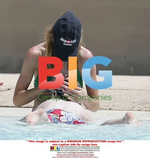 Calista Flockhart and son at pool