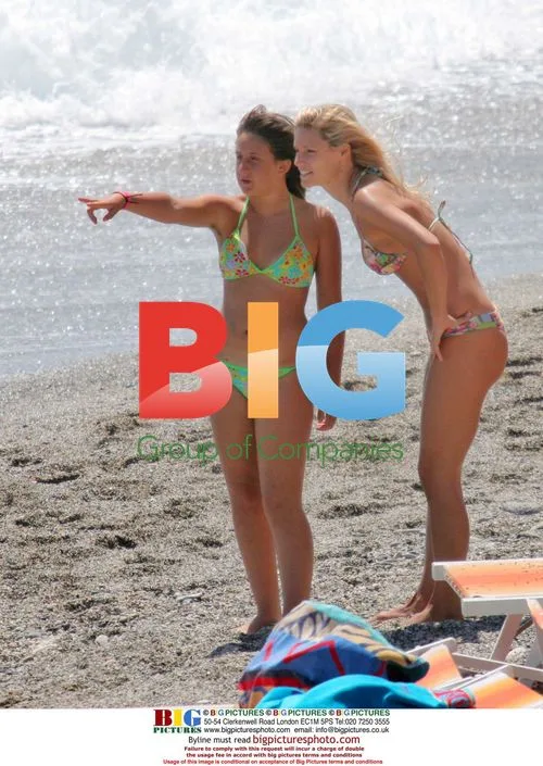 Michelle Hunziker and daughter on beach