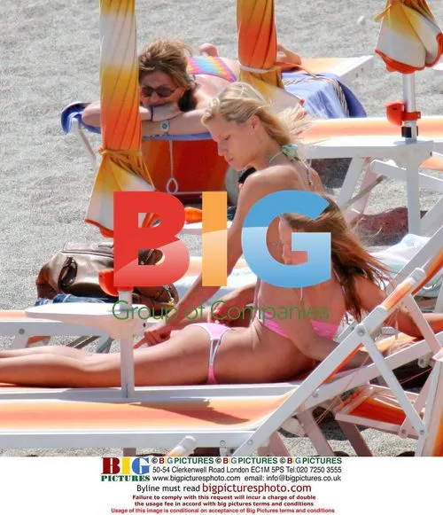 Michelle Hunziker and daughter Aurora on beach