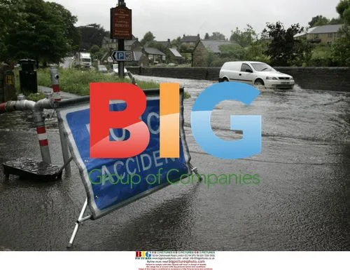 Flooded A623 Road in Baslow, UK