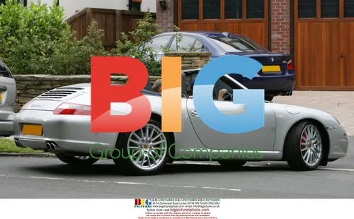 Kerry Croft Seen Leaving Home in Porsche