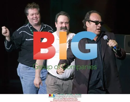 Jim Belushi dances with audience at show