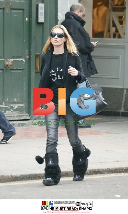 Woman in Black Outfit with Fur Accessories