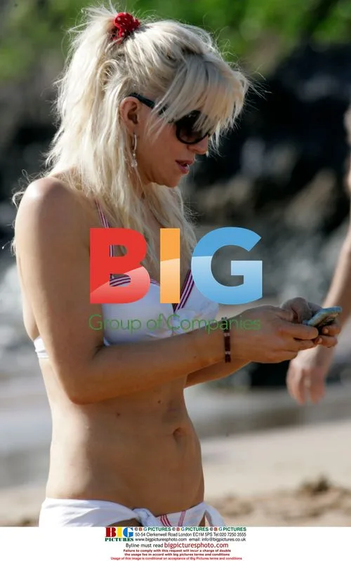 Courtney Love Goofs Around with Photographers in Maui