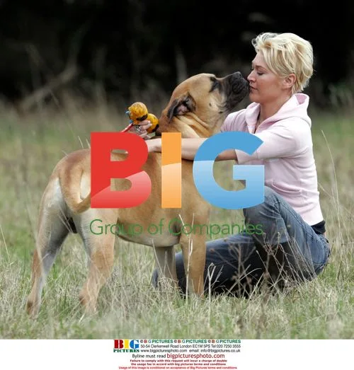 Jo O'Meara Plays with Her Dog