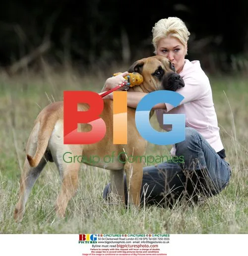 Jo O'Meara Plays With Dog