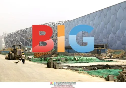 Worker Sweeps Access Road at Beijing Olympic Site
