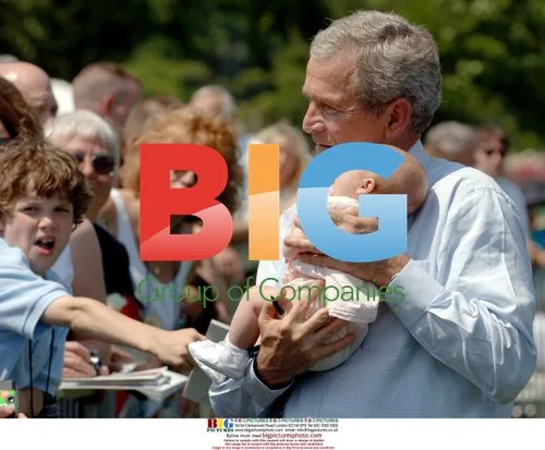 George W. Bush Holds Infant at Peace Officers' Memorial