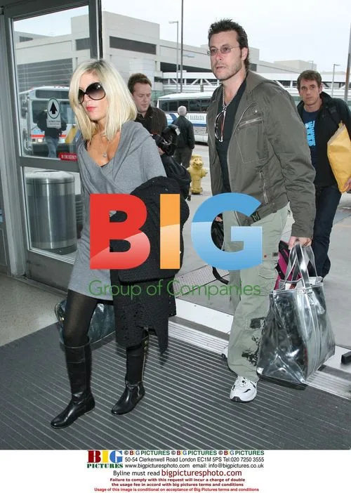 Tori Spelling with husband and baby son at LAX