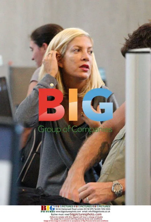 Tori Spelling, Dean McDermott, and baby Liam at LAX