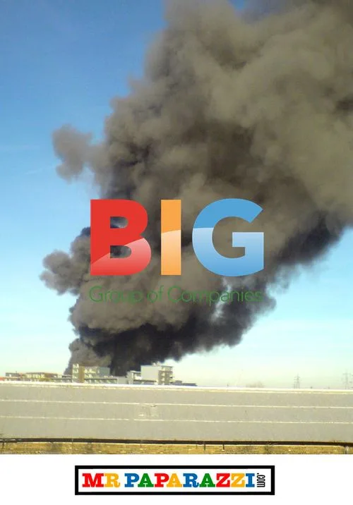 Thick Black Smoke Over London Buildings