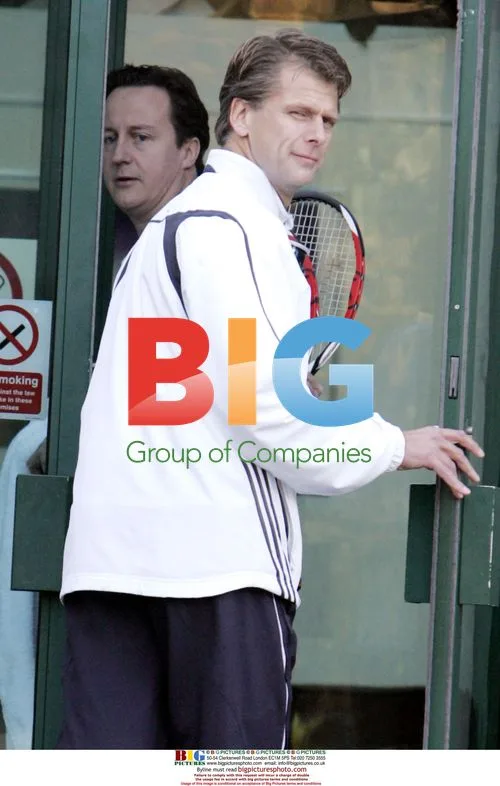 David Cameron and Andrew Castle play tennis