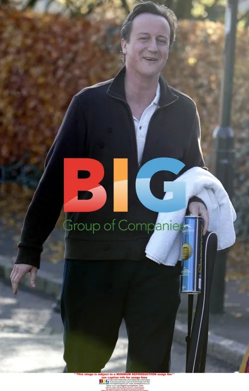 David Cameron plays tennis with Andrew Castle