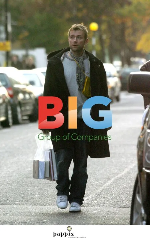 Damon Albarn Strolling with Books in London