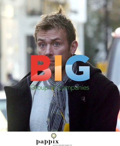 Damon Albarn Strolls with Books in London