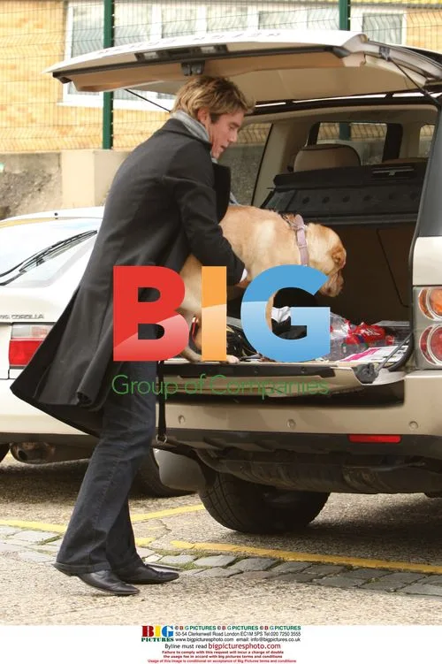 Ziggy Lichman Walks Dog in Park, London