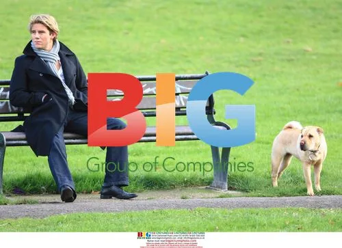 Ziggy Lichman Walks Dog in Park, London
