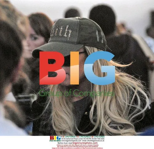 Lindsay Lohan and boyfriend depart JFK Airport