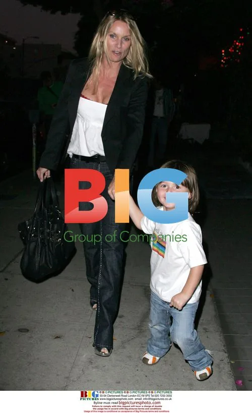 Nicollette Sheridan with young boy in LA