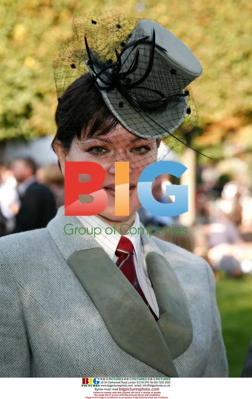 Entrant Shows Off Hat at Prix de l'Arc de Triomphe