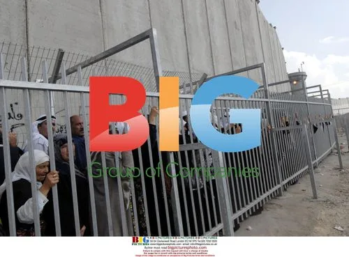 Palestinians wait at Israeli checkpoint
