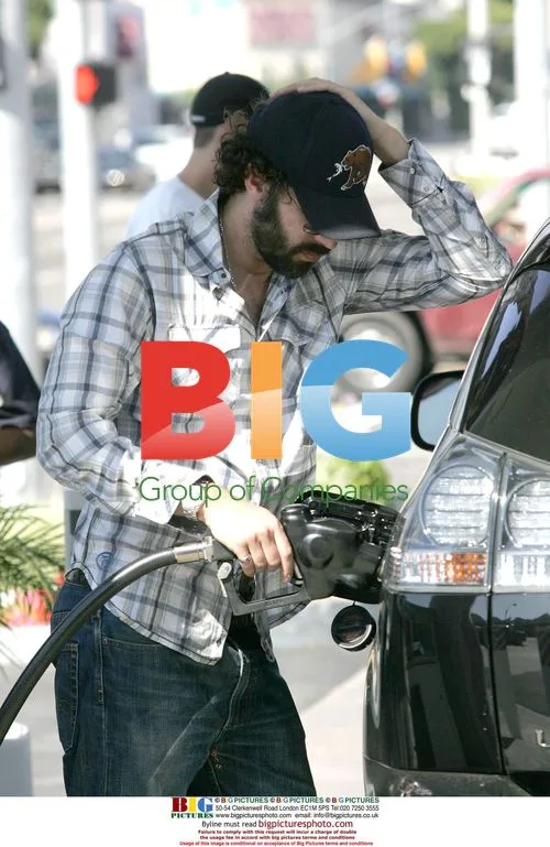 Sacha Baron Cohen and Isla Fisher at Gas Station