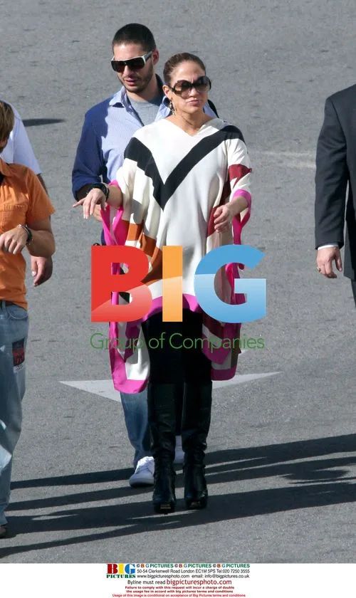 Pregnant J-Lo Shows Baby Bump with Stylist