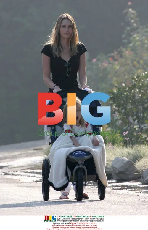 Ryder Robinson gets stroller ride from Sara Foster