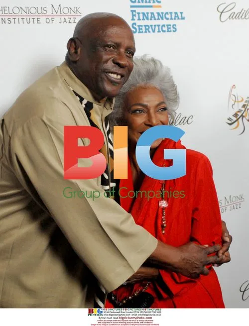 Lewis Gossett Jr. hugs Michele Nicholson on red carpet