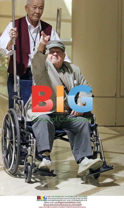 Mickey Rooney at LAX with Wife