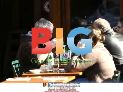 Philip Seymour Hoffman Chatting with Friends at Bar Pitti