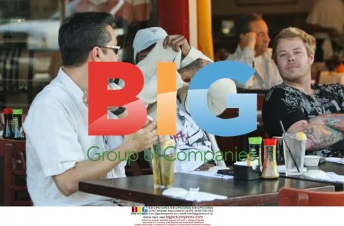 Tricky dines with friends, hides from camera