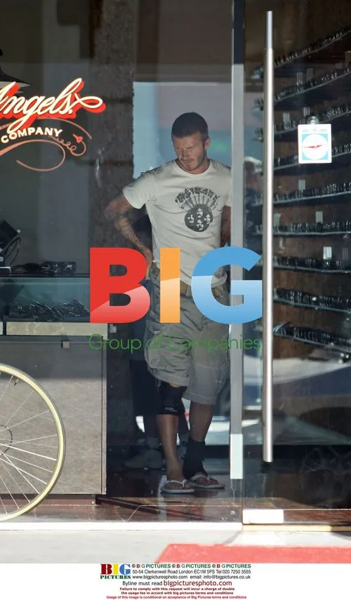 David Beckham and son Brooklyn shopping