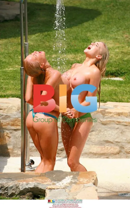 Blonde models sunbathe topless in Caribbean