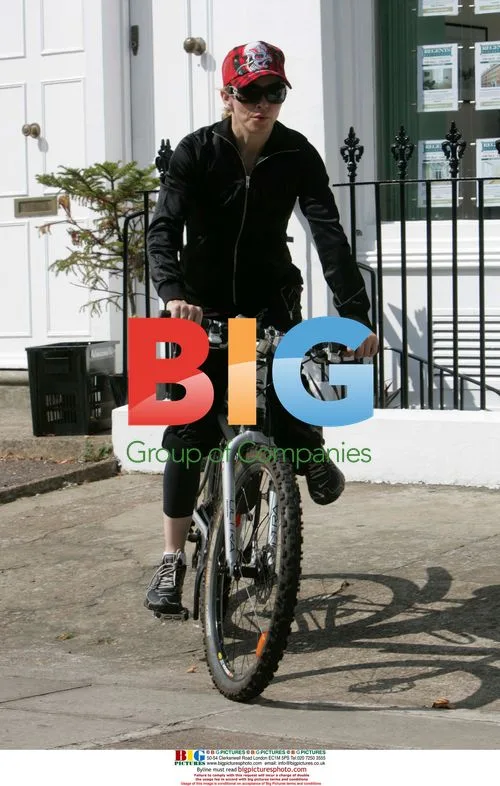 Madonna Leaving Gym on Bike
