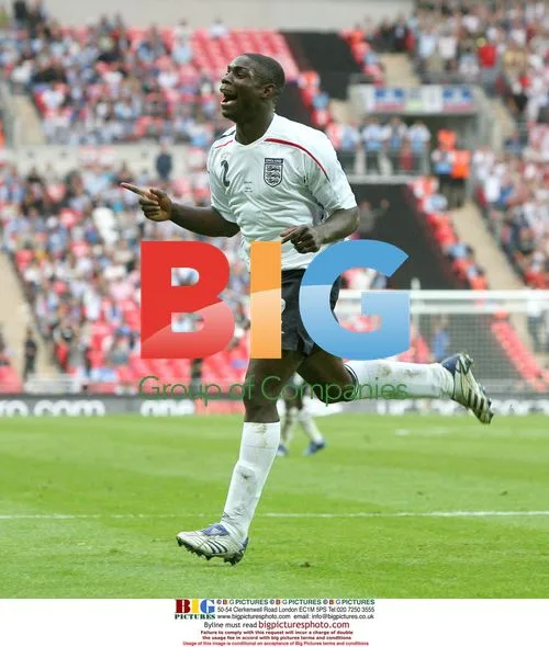 Micah Richards celebrates scoring for England