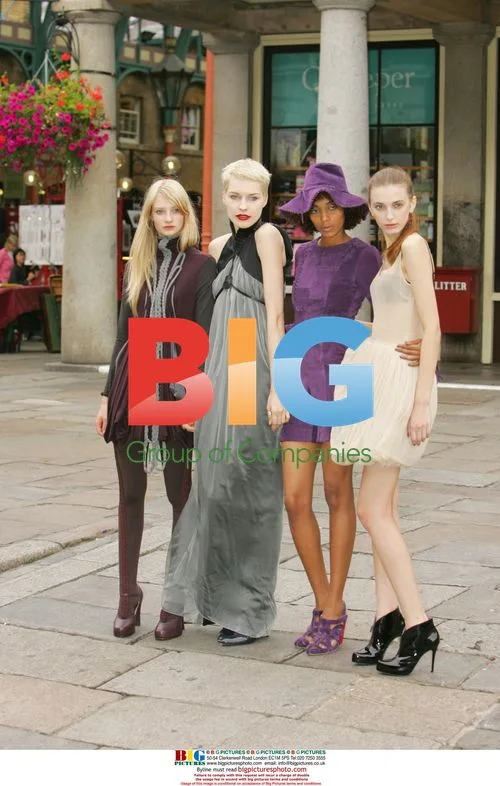 Colin McDowell poses with IMG models at Covent Garden