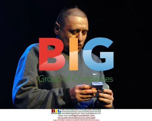 Shaun Ryder Smoking on Stage in Dublin