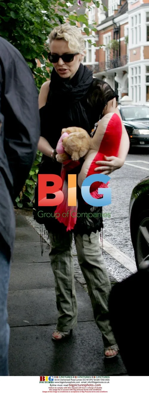 Singer Kylie Minogue signs for fans