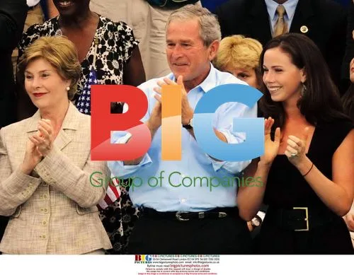 George Bush waves US flag at 2008 Beijing Olympics
